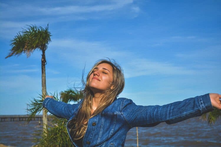 Happy woman on a seaside smiling