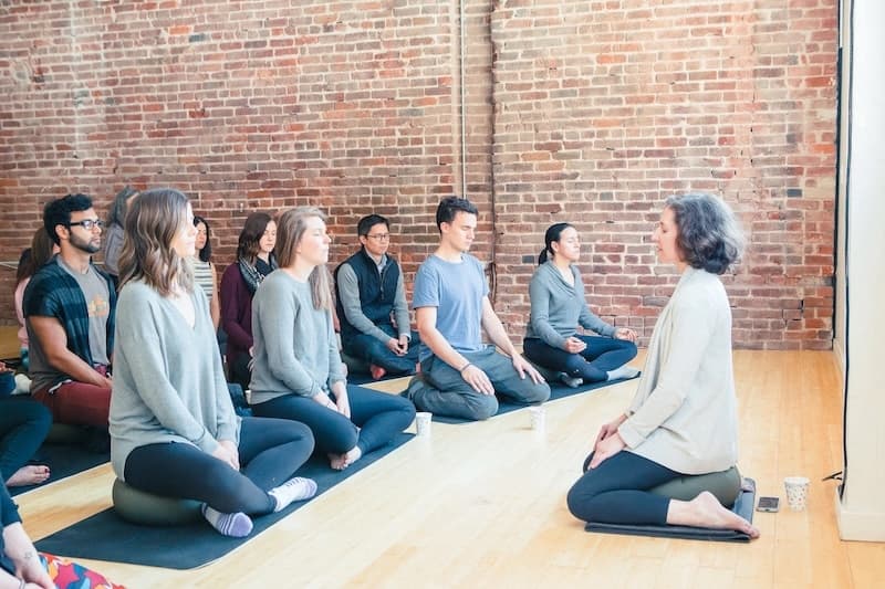 mindfulness teacher leading meditation class